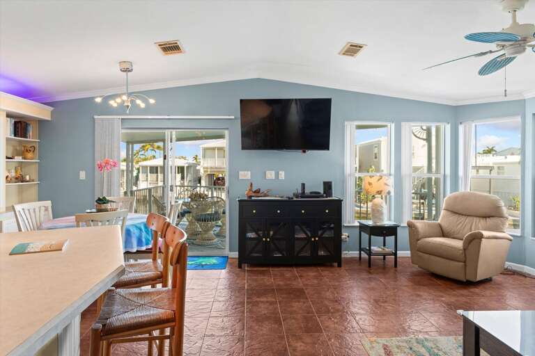 Spacious Living Space Leading To Poolside Patio, Porcelain Floors, Plush Seating