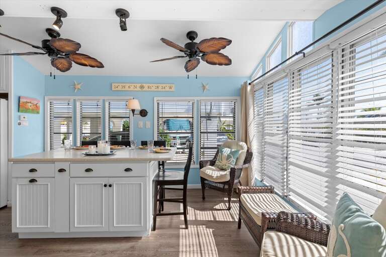 Light-filled Living Space With Island Style Kitchen And Striped Seating