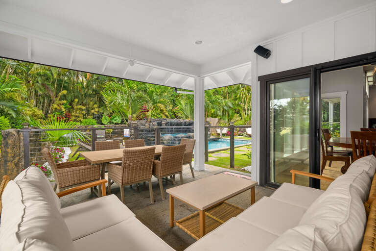 view of dinning room, kitchen, backyard of the pool area