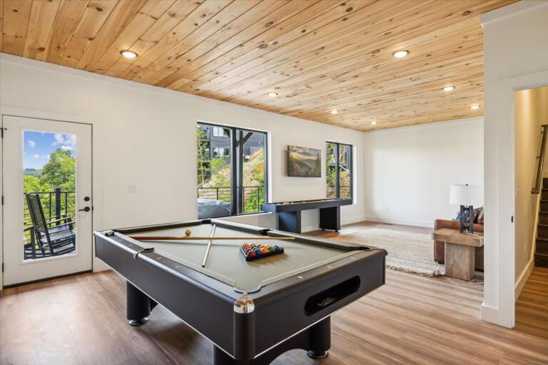 Spacious Room With Pool Table, Paneled Ceiling, And Patio Doors Spacious Room With Pool Table, Paneled Ceiling, And Patio Doors