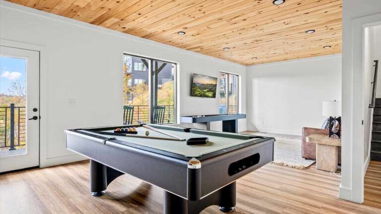 Game Room with Full Size Pool Table, Large Screen SMART TV, Sand Shuffle Board, Full Size Sofa and Private Bathroom with Shower 