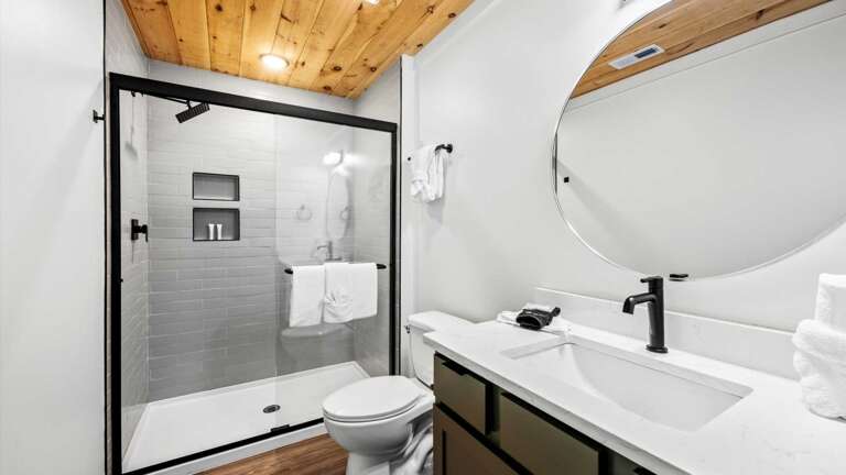 1 King Bedroom and 1 Bedroom with 2 Sets of Twin Bunks, Shared Bathroom in hallway