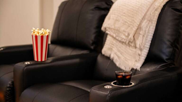 Theater Room with Stadium seating and Lounging Couch  