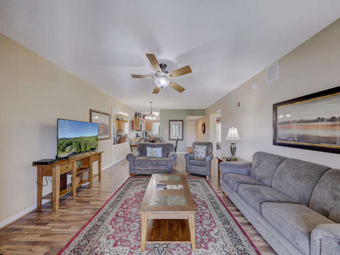 Vacation Rental Living Room With Plush Seating And Polished Floors