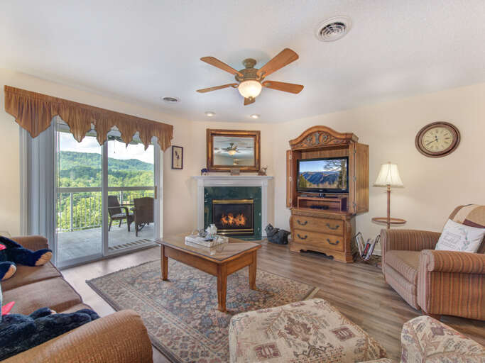 Living Room With Fireplace, Sliding Door To Scenic Balcony