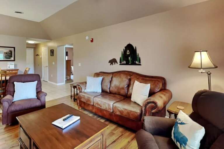 Lamp-lit Living Space With Leather Sofa And Chairs