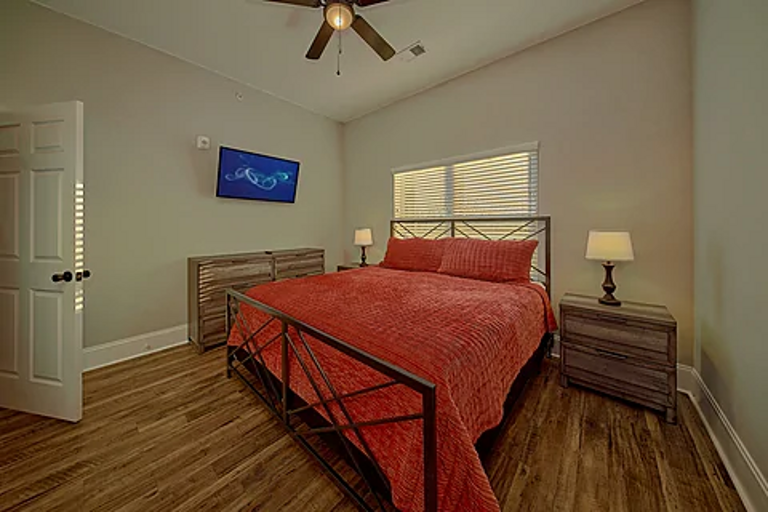 Main bedroom with king bed and tv 