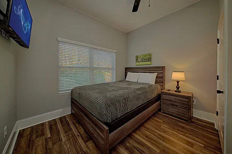 Second bedroom with queen bed and tv