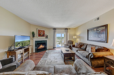 Spacious Living Room with Gas Fireplace, Sleeper Sofa and SMART TV with Cable & WIFI throughout vacation rental