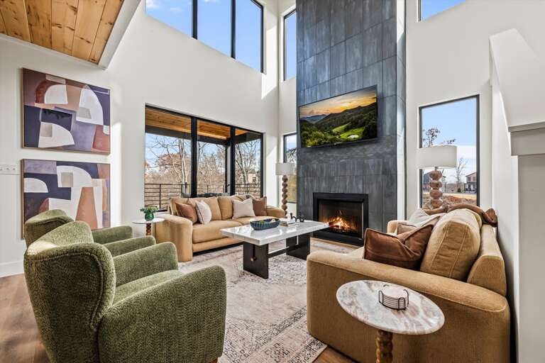 Main level: living room, with modern, open kitchen, dining and living room. Living Room features gas fireplace, large SMART TV, and Wifi