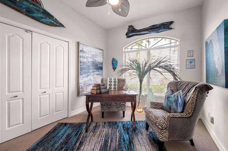 Designated Office Space with Desk and Views of the Garden Separated by French Doors