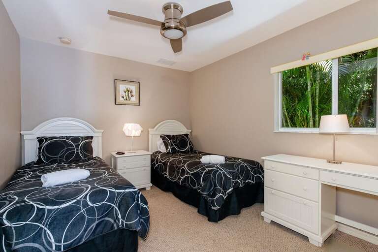 Guest Bedroom with Two Twin Size Beds, Desk and Garden View