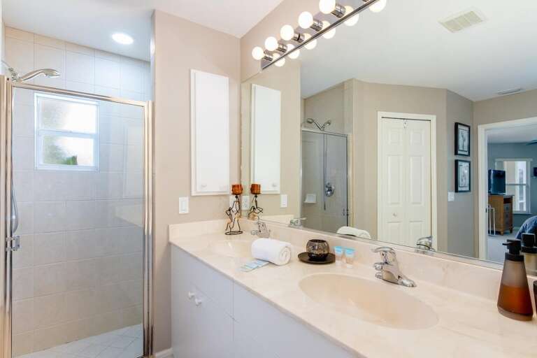 Main En-Suite Bathroom with Double Sinks and Walk in Shower and Walk in Closet