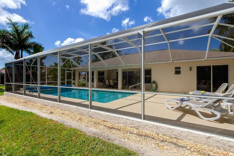 The North Western Facing Pool is Surrounded by Palm Trees and has amazing Water Views