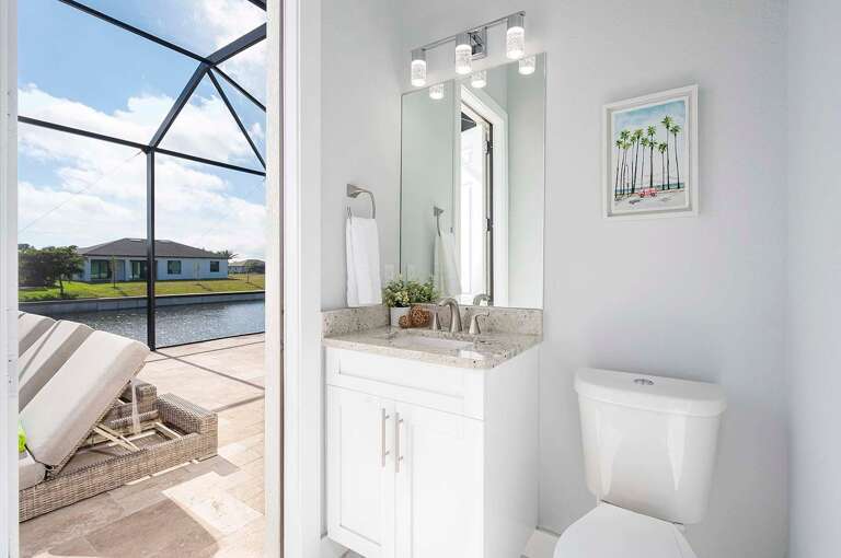 Half Bathroom with Access to Lanai and Main Living Space