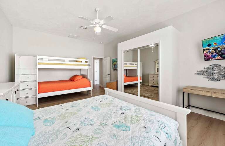 Large Bedroom Featuring Queen Bed and Bunk Bed