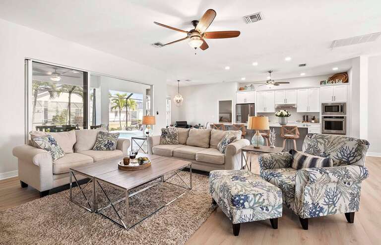 The Living Room is the Center of the Home with Views of the Kitchen, Dining, Sitting and Lanai