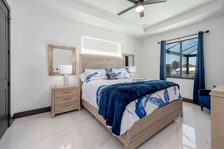 Guest Bedroom with King Bed and Pool View