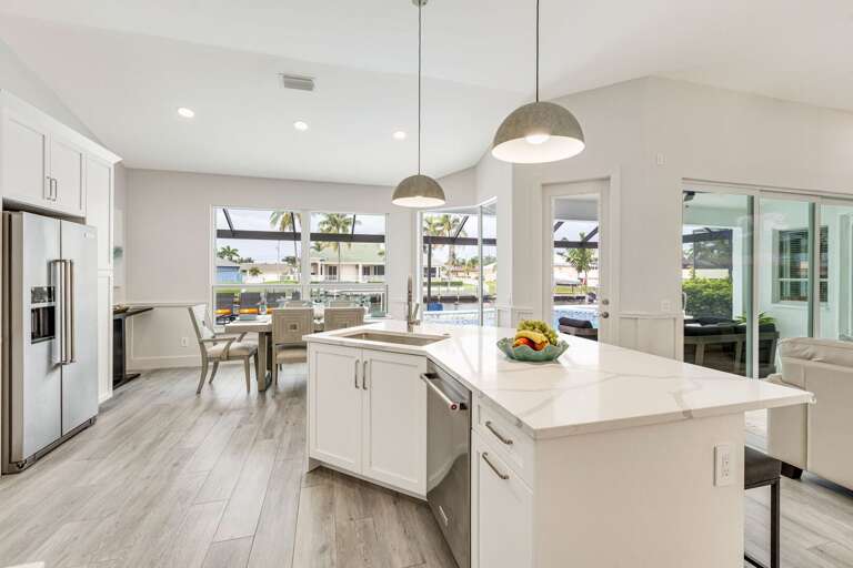 Enjoy Preparing Meals with Views of the Lanai and Pool