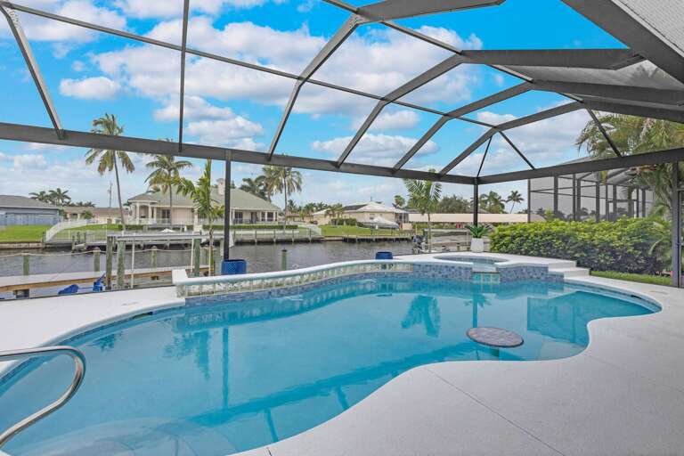 Picture Windows in Screened in Lanai offer Fantastic Views of the Canal and Sunsets