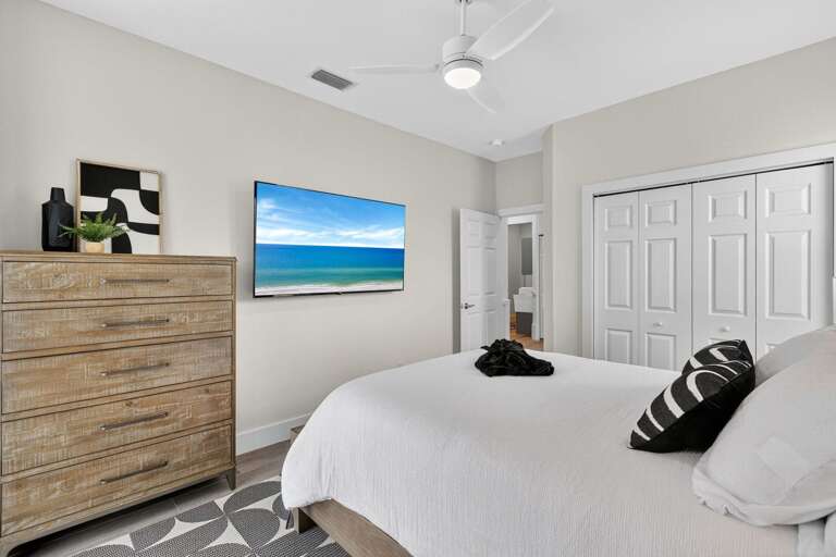Queen Bedroom Features TV