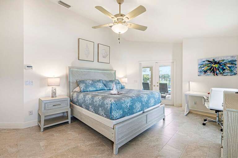 Welcome to your Main King Bedroom Suite with Desk and French Doors to the Lanai
