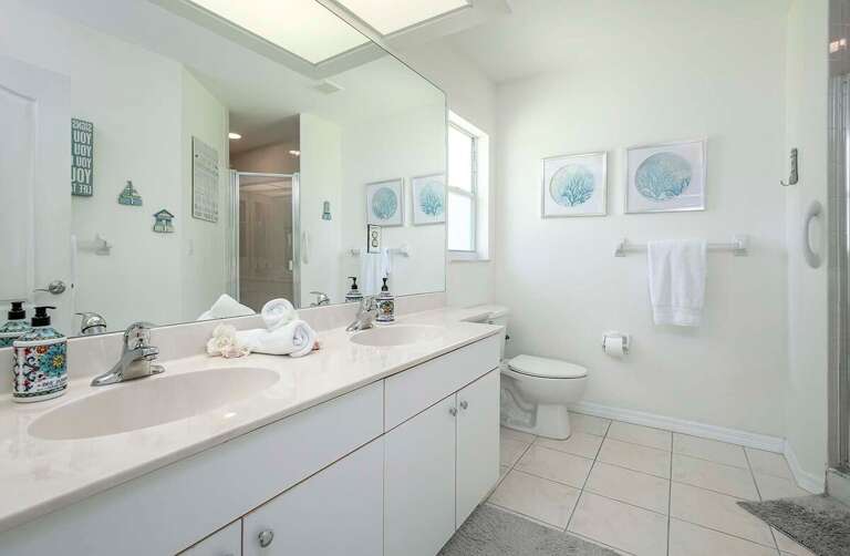 En Suite Bathroom to Main Bedroom with Dual Sinks and Shower