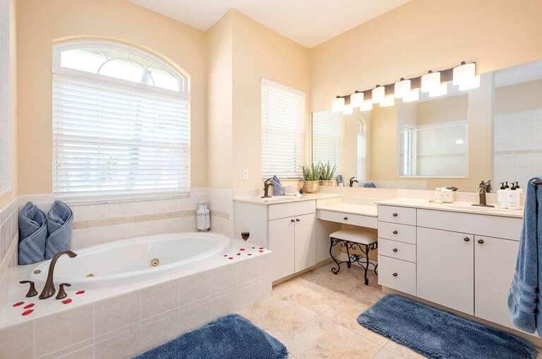 Main Bathroom with Garden Tub and Walk in Shower and Dual Sinks with Make Up Area