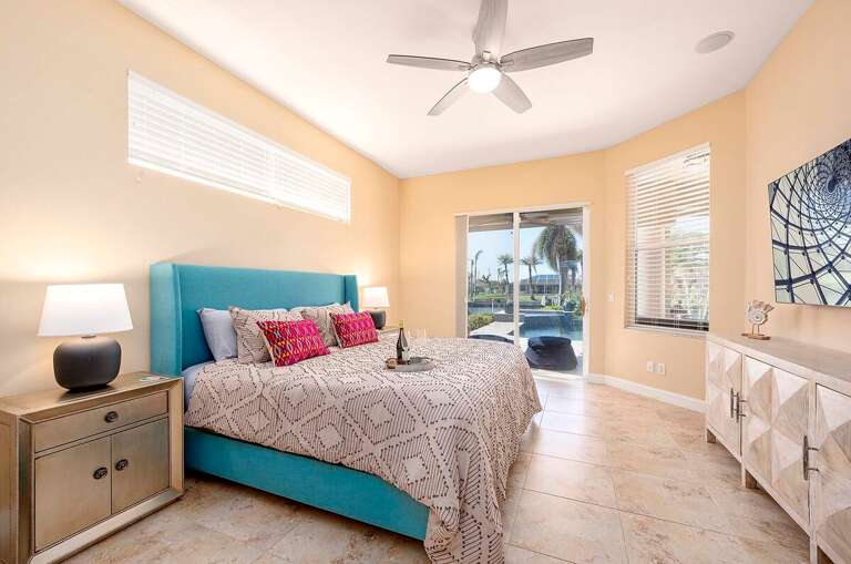Main Bedroom with King Bed and Access to the Pool Area
