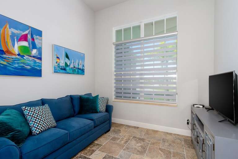 Den with Sleeper Couch and TV