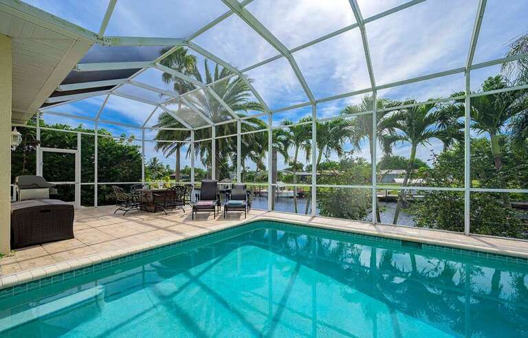 The Swimming Pool features a Pool Cage