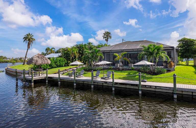 Bliss on the Bay Dock with Tiki Hut, Umbrellas and Seating