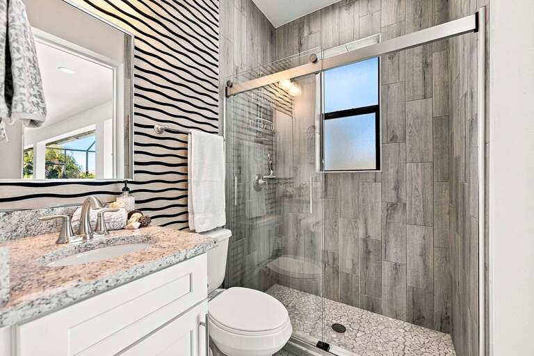 En-Suite Guest Bathroom to Bedroom 3 with Access to Pool Area