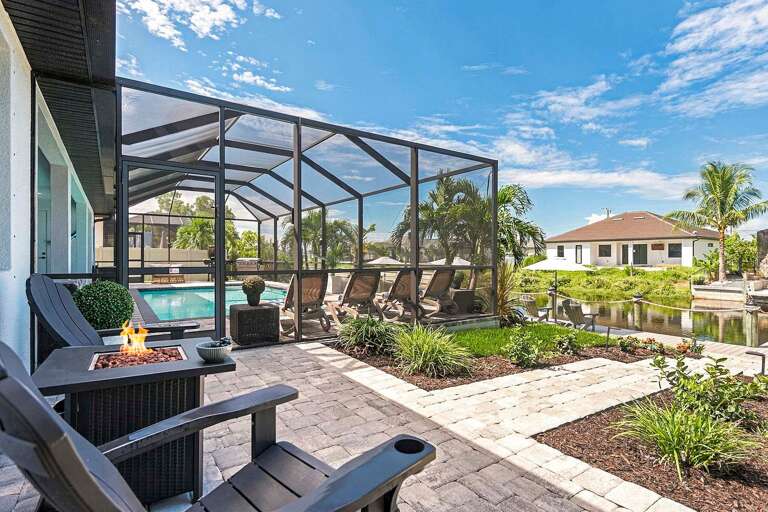 Outdoor Sitting Area with Fire Pit and Uncovered Lanai Area Great for Morning Coffee or Evening Cocktails