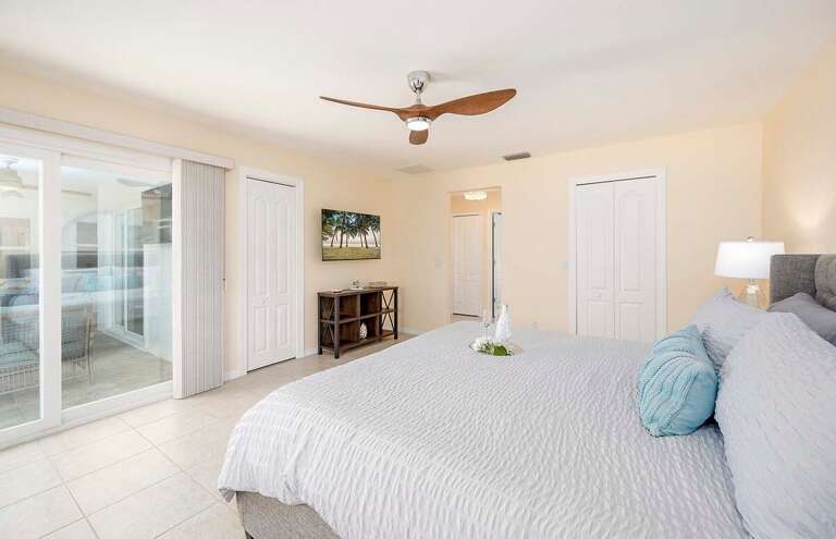 Main Bedroom with King Bed and Access to Pool Area