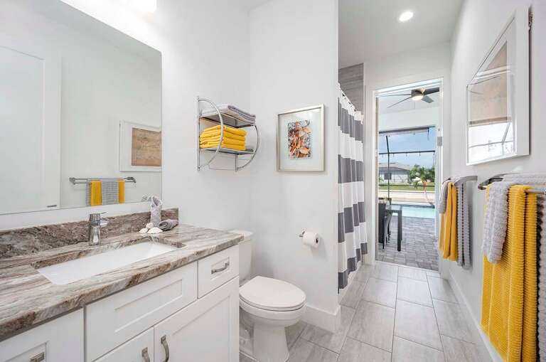 Guest Bath with Access to Pool Area and Shower Tub Combo