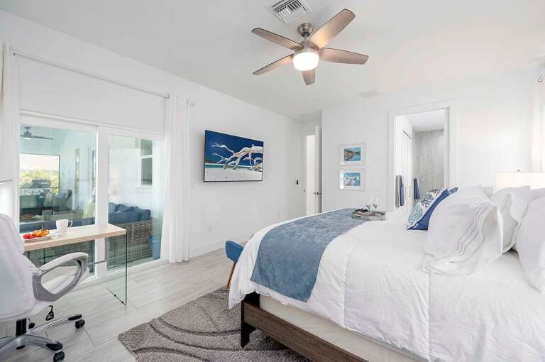 King Bedroom with View to Pool Area and En Suite Bathroom