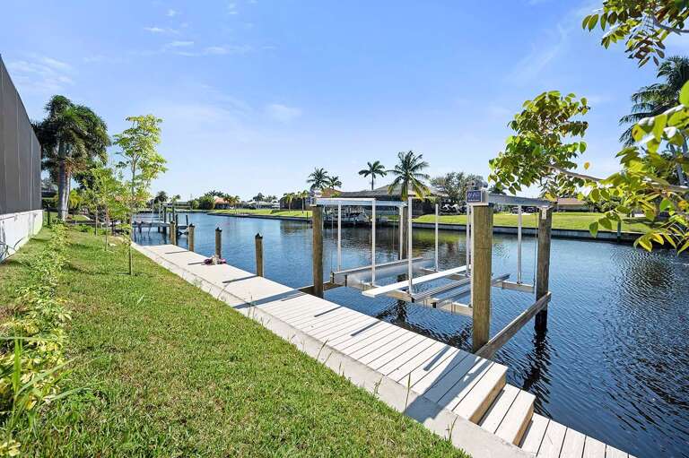 Rear Exposure and Backyard of Bluewater with Boat Dock and Lift