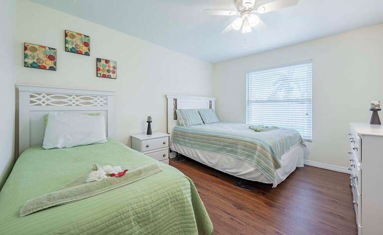 2nd Guest Bedroom features 1 Twin and 1 Queen Bed with a Garden View