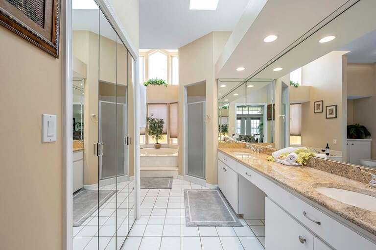 Main Bathroom Suite with Garden Tub, Walk in Closet and Dual Sinks as well as Walk in Shower