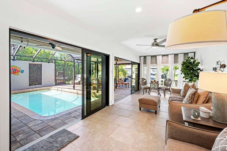 Large Airy Sitting Area with Couches and Views of the Lanai