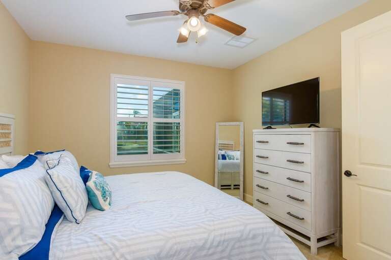 Guest bedroom 2 features a king size bed
