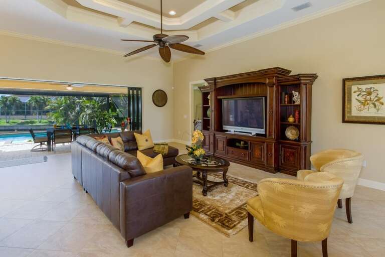 View from the dining room towards the living room and out to the swimming pool