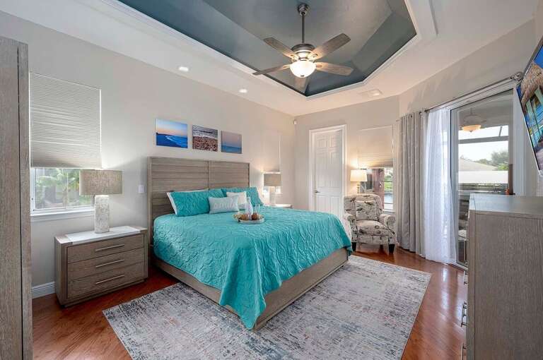 Main Bedroom with Lanai Access and 1/2 Bathroom access to Pool and Bedroom