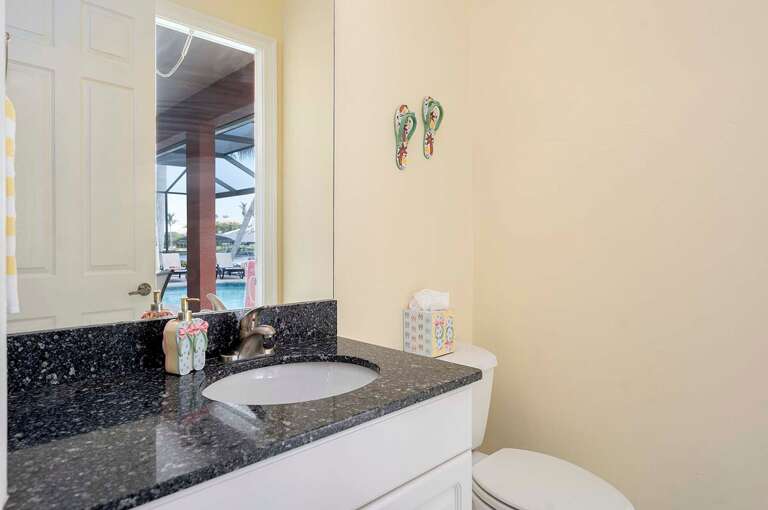 Pool Bathroom with Sink and Toilet (Accessible only from the Lanai)