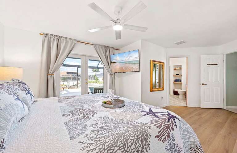 Main King Bedroom Suite with French Doors to the Pool Area