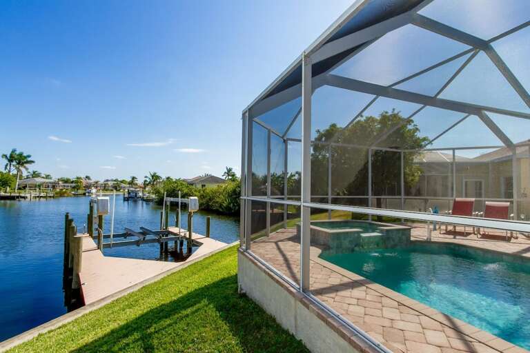 Outdoor Yard with Boat Dock and Lift as well as Gulf Access