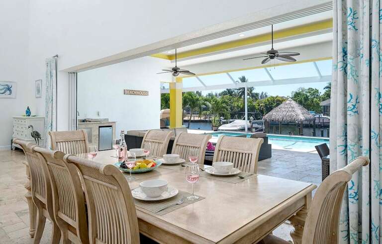 Dining Table with Pool Area Views
