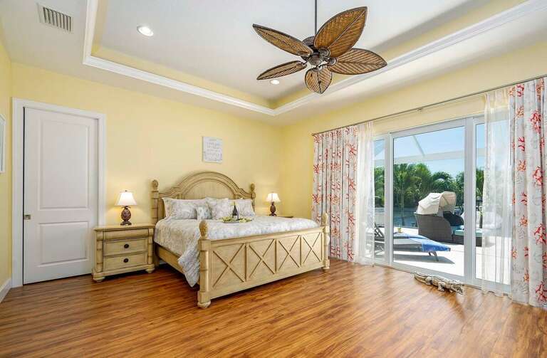 Main Bedroom with King Size Bed and Pool Access