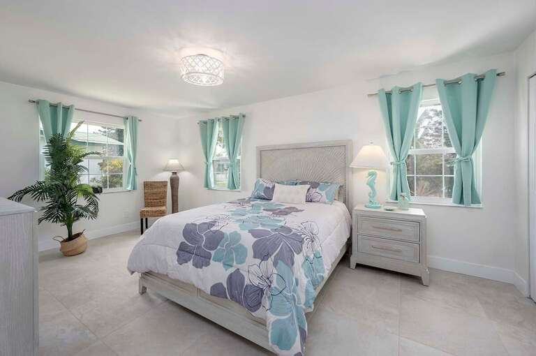 Guest Bedroom with Garden View and Queen Bed and TV